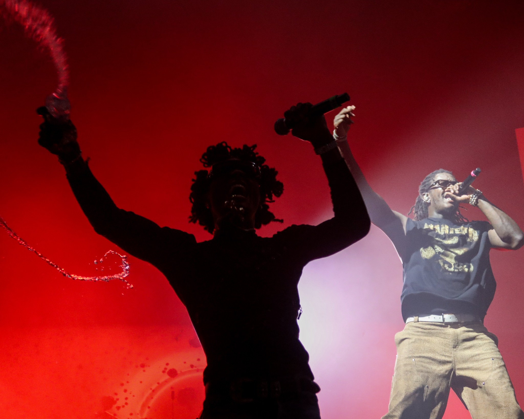 YSL artists performing against red stage lighting