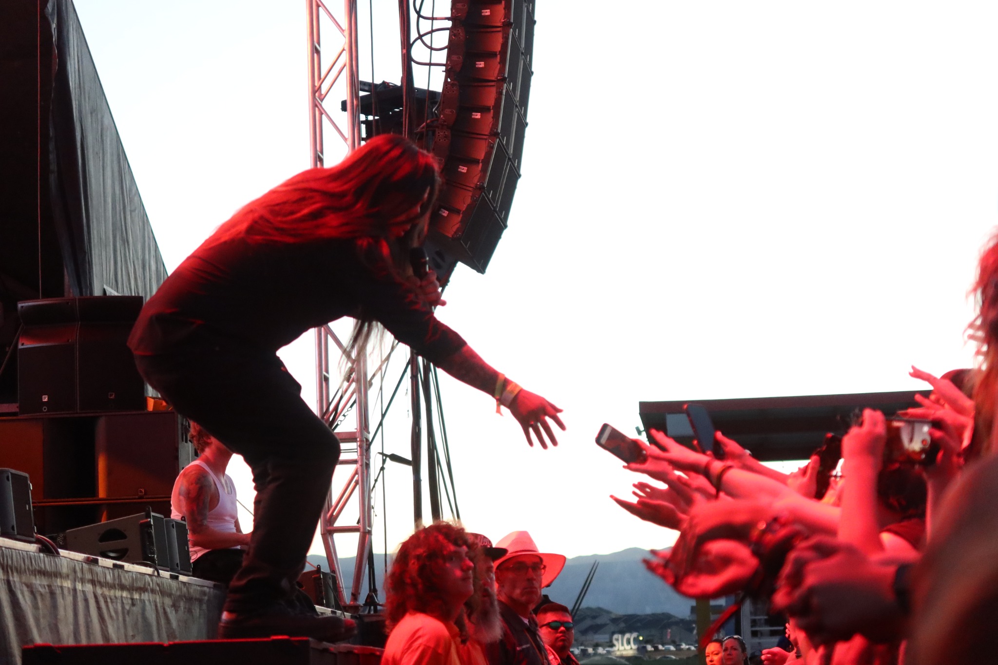 A Sublime Fest performer reaching toward the front row