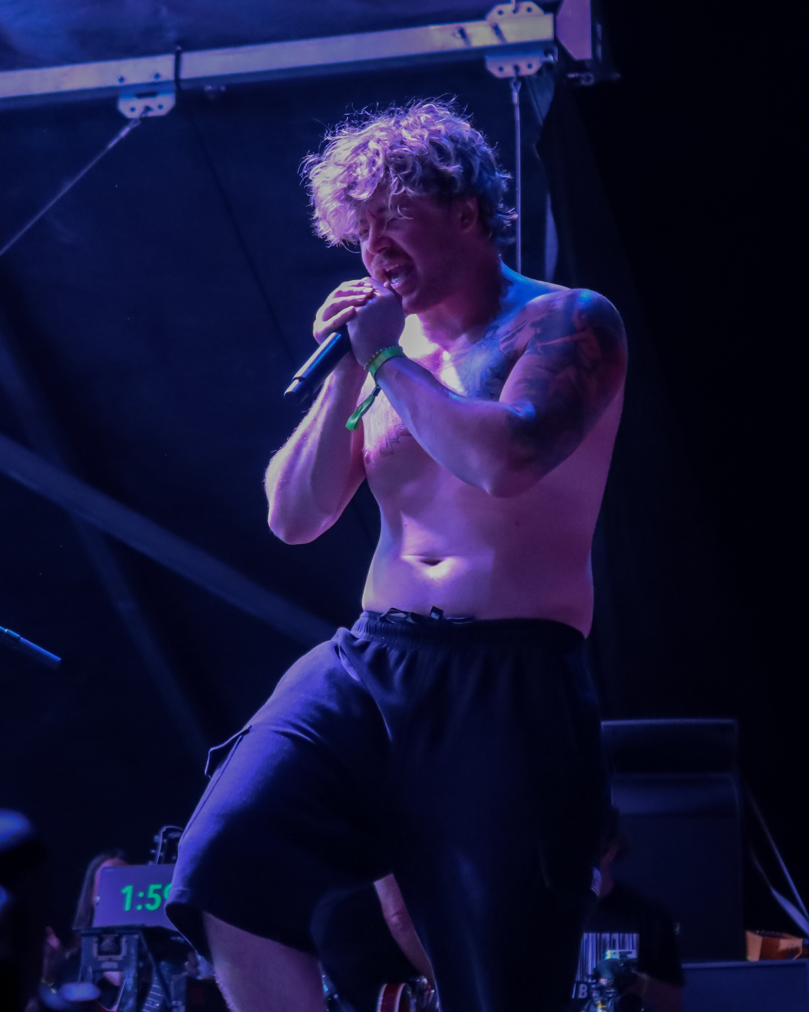 Sublime Fest singer performing under blue light